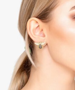 Close-up of 18K gold plated Honey Bee stud earrings with detailed wings and a polished finish, displayed on a soft neutral background.