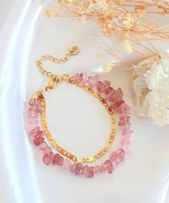 Double-layered Strawberry Quartz bracelet with 24K gold accents styled on a neutral background.