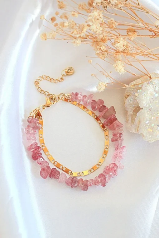 Double-layered Strawberry Quartz bracelet with 24K gold accents styled on a neutral background.