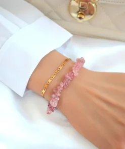 Double-layered Strawberry Quartz bracelet with 24K gold accents styled on a neutral background.
